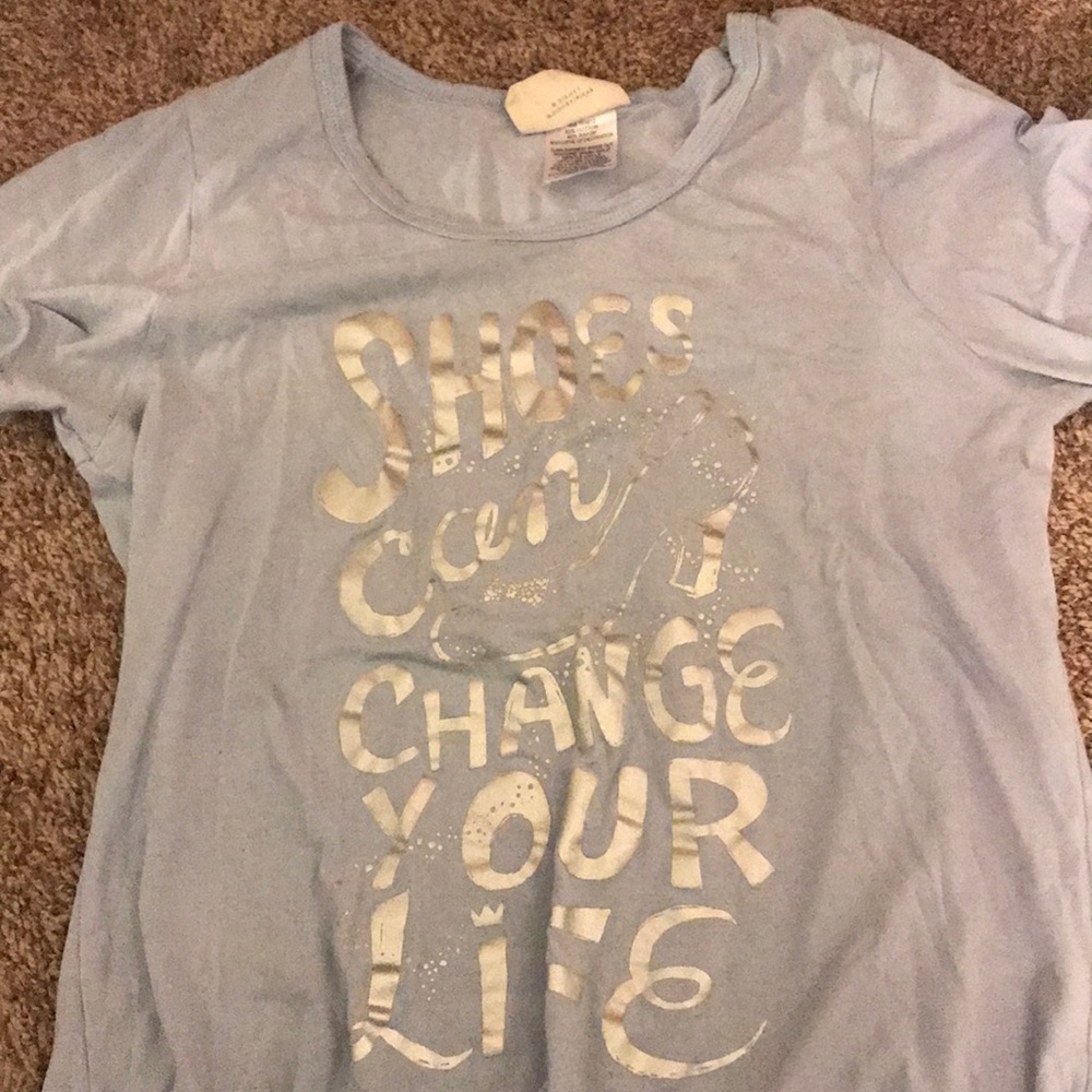 light blue top with silver writing